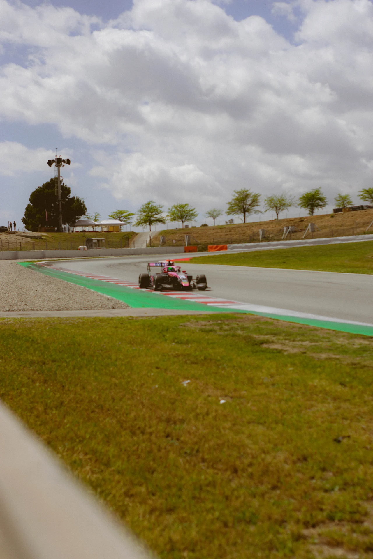 Racing car seen from high above the pit straight